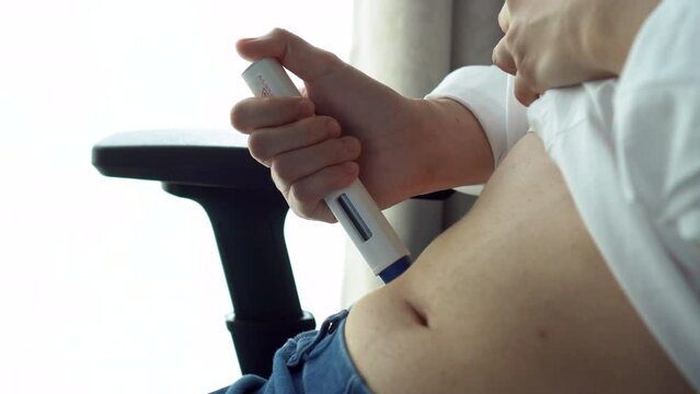 Woman doing Self-inject migraine medical treatment to prevent or reduce headache in adult
