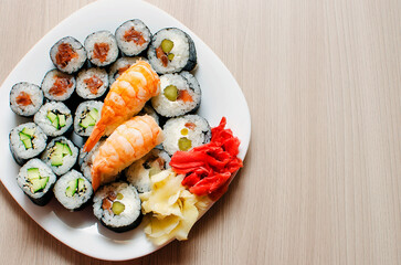 Mix of sushi and rolls, close-up. Japanese traditional food. Top view. Place for text, copyspace.
