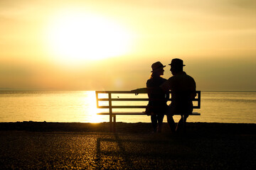 silhouette of a loving couple at sunset on the seashore