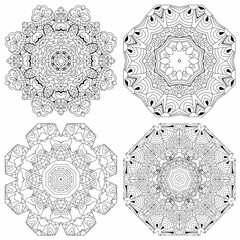 Hand drawn zentangle set of 4 mandalas for coloring page.