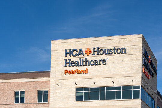 Pearland, Texas, USA - February 14, 2022: HCA Houston Healthcare sign on the building in Pearland, Texas, USA. 
HCA Houston Healthcare is a provider of health care. 