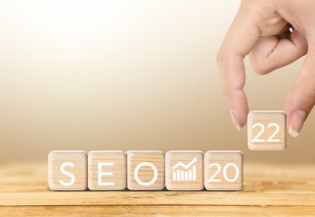 SEO, Search Engine Optimization 2022, wooden block represents growing business goals