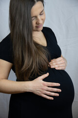 Before maternity leave: pregnant woman on 9th month. High quality photo