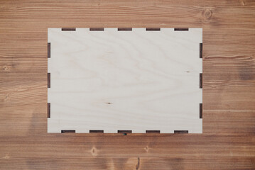 Wooden empty box on wooden background. Top view.