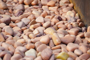 Plenty of brown Small Pebble Stones for wallpeper