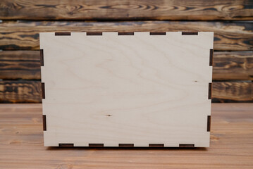 Wooden empty box on wooden background. Top view.