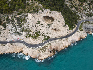 Aerial view of Grotta dei Falsari, Robber's Cave in Liguria, near Varigotti, Noli and Capo Noli. Drone photography of this cave in the rock with Aurelia street of Ligury, province of Savona.