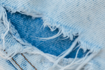 Ripped jeans, close-up. Fashion denim torn pants