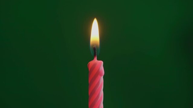 Red birthday celebration candle fire flame. Holiday party. Chroma key background