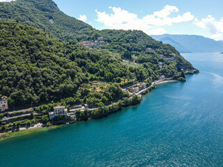 Fototapeta na wymiar Aerial view of Bellano, panoramic view from the drone to the famous old Italy town of Como lake. Near Varenna and Lierna, Bellano is a small town in Como, near Lecco, in Lombardia.