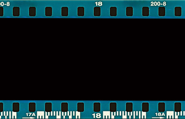 Film scan. Digital number and bezel on film photographs scanned. 35mm film frames strip scanned with signs of usage on bezel. blank old film strip frame background. Retro films border with numbers.