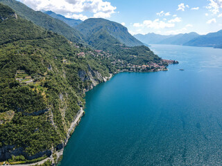 Fototapeta premium Aerial view of Bellano, panoramic view from the drone to the famous old Italy town of Como lake. Near Varenna and Lierna, Bellano is a small town in Como, near Lecco, in Lombardia.