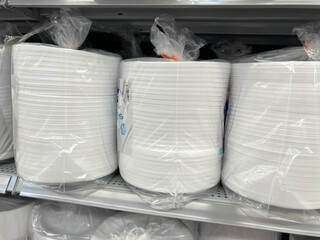 Foam Plates on the shelves in a supermarket.