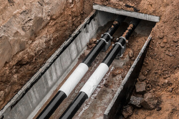 Repair of the water line of the heating main pipe in the ground trench pipeline at the construction...