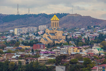 Fototapeta na wymiar 2018: View of Tsminda Sameba Cathedral from Narikala Fortes in Tbilisi, Georgia