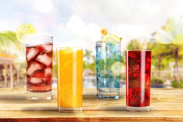 Cocktails drinks. Classic alcoholic long drink with berries, lime, herbs and ice