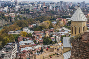 Fototapeta premium Aerial view of Old Tbilisi from Narikala Fortes. Sunny day in Tbilisi, Georgia