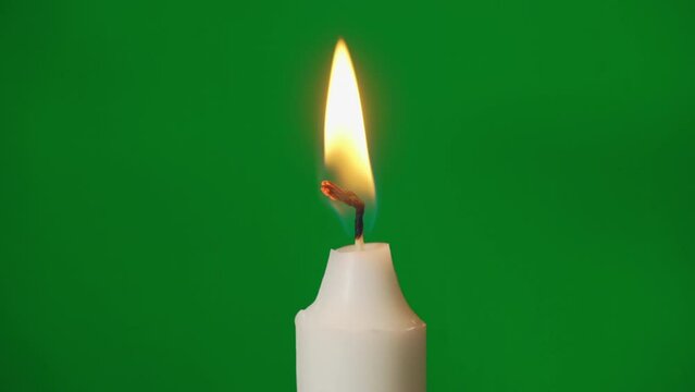 White candle fire flame. Holiday party, religious. Light a candle, then blow out