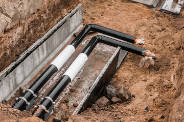 Repair of the water line of the heating main pipe in the ground trench pipeline at the construction...
