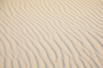 background of sandy beach with soft waves