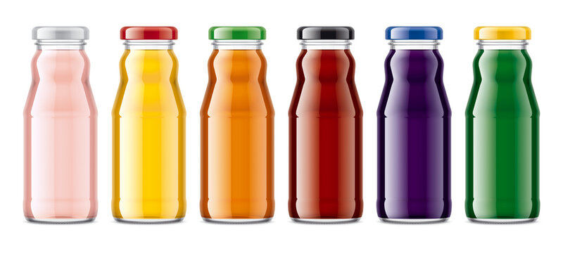 Set of Glass Bottles with transparent Juices.  