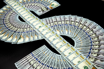 US dollar sign made of one hundred dollar banknotes. Cash money banknotes. US dollars in dollar...