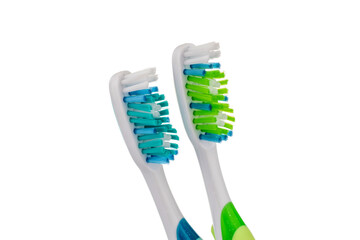 Two toothbrushes, macro, isolated on a white background.


