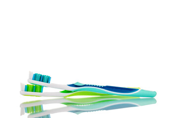 Two toothbrushes, macro, isolated on a white background.

