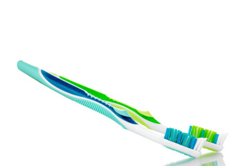 Two toothbrushes, macro, isolated on a white background.

