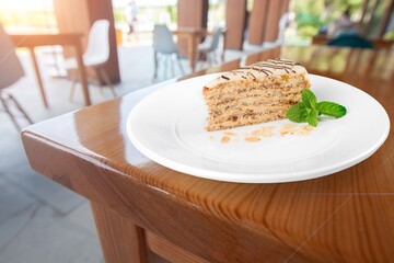 Honey cake slice on white plate