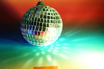 Disco ball with colored flash foils photographed in the studio