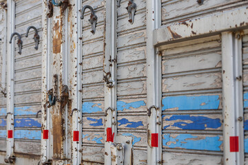 close-up of an old wooden truck body with hooks
