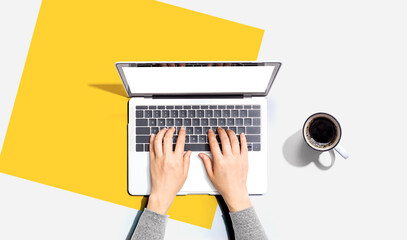 Person using a laptop computer from above