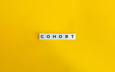 Cohort Word on Letter Tiles on Yellow Background. Minimal Aesthetics.