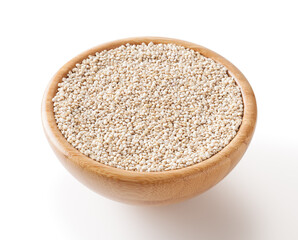 Dried white quinoa seeds in wooden bowl isolated on white background with clipping path
