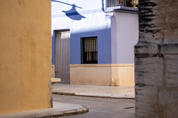 Narrow village street, with a house painted blue
