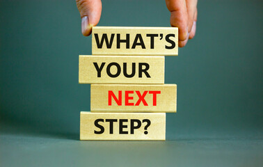 What is your next step symbol. Concept words What is your next step on blocks. Businessman hand....