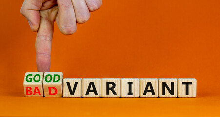 Good or bad variant symbol. Businessman turns cubes and changes words bad variant to good variant....