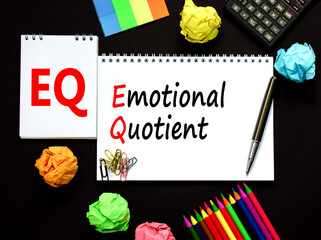 EQ emotional quotient symbol. Concept words EQ emotional quotient on white note. Metallic pen,...