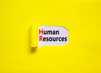 HR Human resources symbol. Concept words HR Human resources on yellow paper on a beautiful yellow table white background. Business and HR human resources concept.