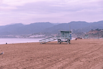 Fototapeta na wymiar Twilight and purple hour on a lifeguard stand on the beach in California