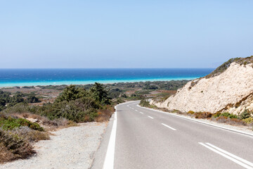 Asphalt road in countryside, Rodos island, Greece