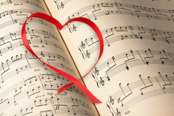 Naklejka premium Small red heart with musical notes