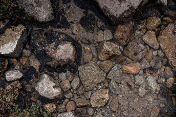 Close-up of clear water flowing through pebbles in stream