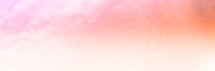 Orange sky with Soft clouds. Fantasy magical sunny sky pastel background is fluffy white cloud. Freedom wallpaper concept. Sweet color dream. 