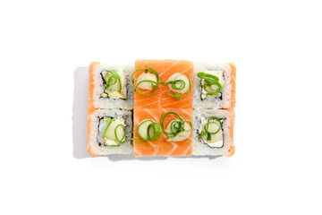 Japanese cuisine - sushi roll with prawn inside,salmon and wasabi sauce outside isolation on white background. Maki sushi with salmon in minimalistic style. Minimal composition with maki sushi.