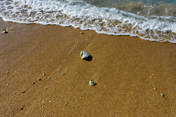 pebbles on the beach with sea waves