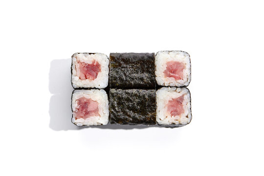 Classic japanesse cuisine - simple sushi with tuna isolation on white background. Hosomaki with tuna in minimalistic style on white background. Minimal composition with maki sushi.
