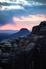 Schrammsteine at sunset from the viewing platform. Schrammsteine Mountains in Elbe Sandstone Mountains in Saxon Switzerland, Germany.