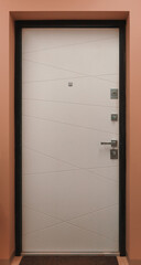 white modern entrance door in a peach-colored wall